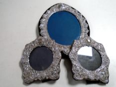 Three silver photograph frames.