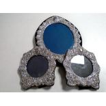 Three silver photograph frames.