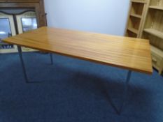 A 20th century Robin Day design Hille dining table on metal legs.