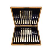 A walnut-cased canteen of EPNS and mother of pearl-handled fish cutlery.