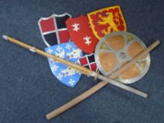 A quantity of re-enactment shields and a wooden sword.