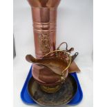 A tray of copper coal helmet, frying pan, further copperware.