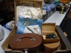 A box of antique baby's clothing,