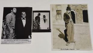 A negative of Dean Martin and Louis Armstrong on stage together with a photo of Charlie Chaplin in