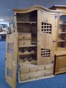 A Mexican pine arch topped double door cocktail cabinet with drawers beneath (Af)