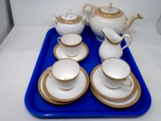 A tray of 19th century gilded tea china