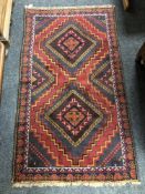 A Baluchi rug 147 cm x 84 cm