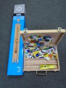 An artist's case containing paint, brushes and palette together with a boxed easel.