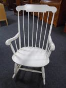 A painted rail backed rocking chair