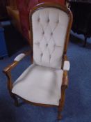 A Victorian style armchair in beige dralon