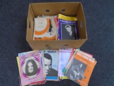 A box of old sheet music.
