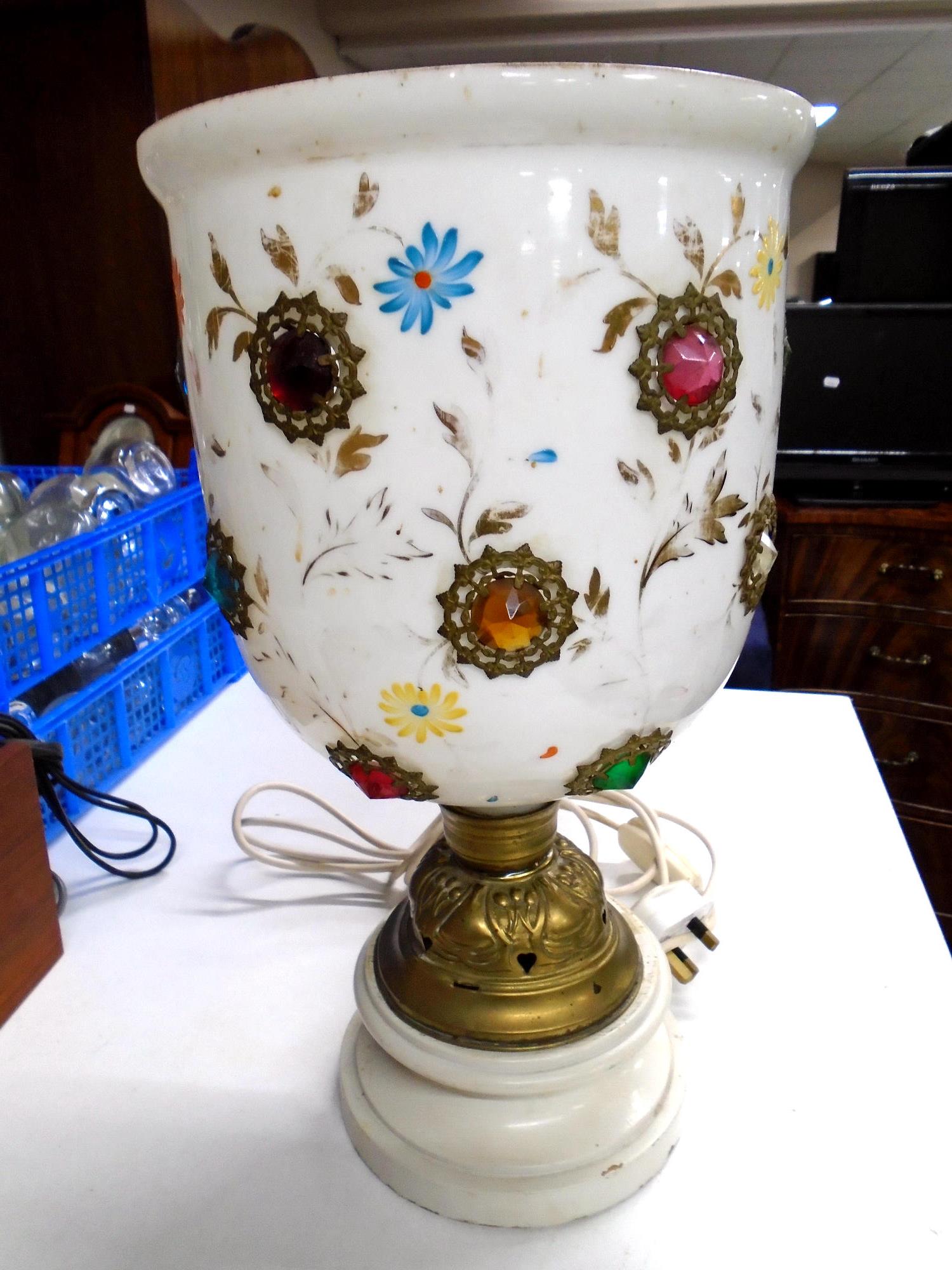 A white glass table lamp with encrusted decoration