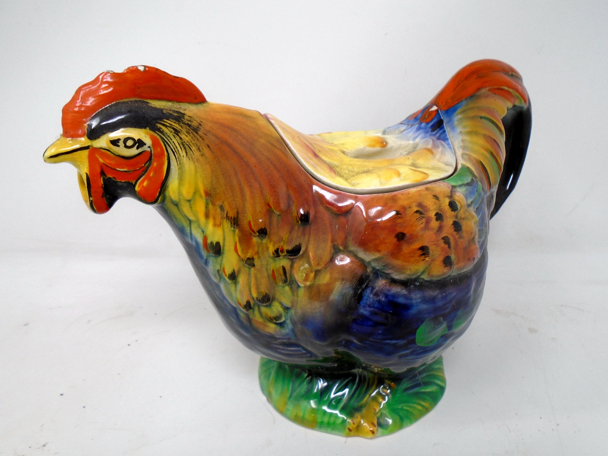 A vintage ceramic rooster teapot.