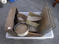 A crate containing a quantity of vintage kitchenalia including cake tins, oven dishes,