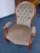 A Victorian style open armchair