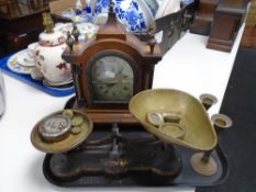 A reproduction mantel clock together with a set of kitchen scales with weights,