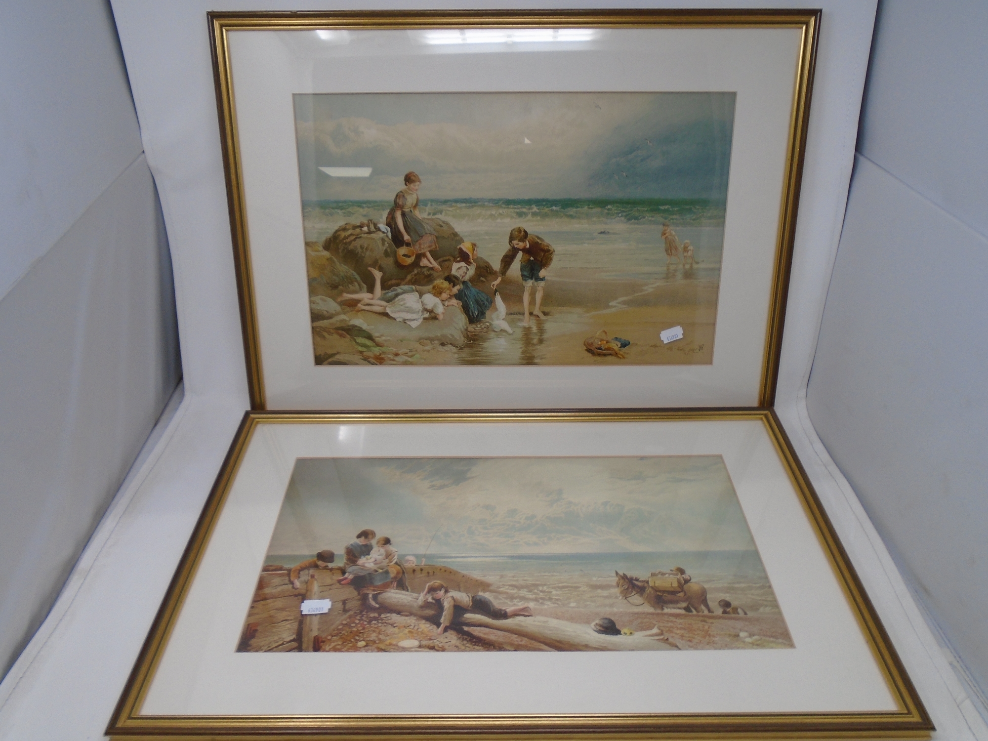 A colour print after Myles Birket Foster : figures playing on a beach, 45cm by 29cm,