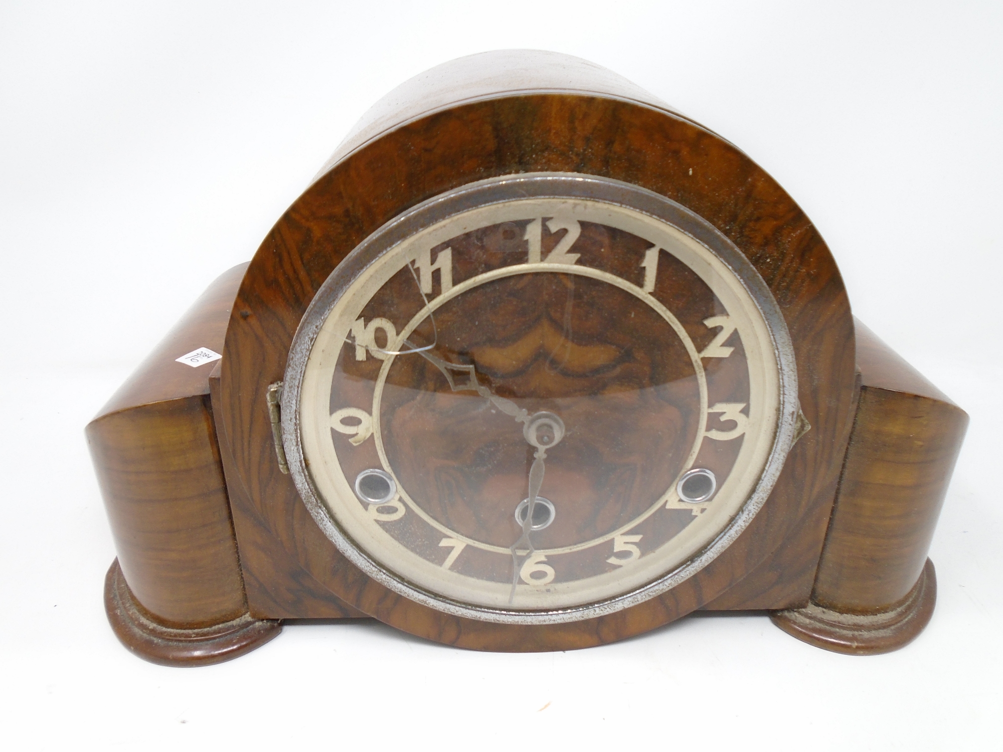 An early 20th century walnut cased mantel clock.
