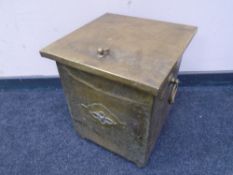 A brass lidded storage box.