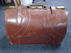 A tan leather holdall.