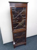 A 19th century double corner display cabinet with astragal glazed doors