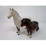 Two Beswick figures of a Shetland pony and a Grey Horse.