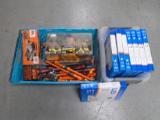 A plastic crate containing a Black & Decker angle grinder, a quantity of assorted screwdrivers,
