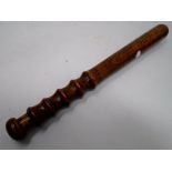 A turned-wooden truncheon.