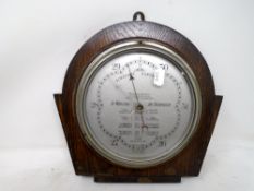 A 1930s Wilson barometer mounted on a board.