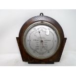 A 1930s Wilson barometer mounted on a board.