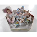 Antique ceramics including bisque figure of a baby, pair of china dolly tops,