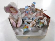 Antique ceramics including bisque figure of a baby, pair of china dolly tops,