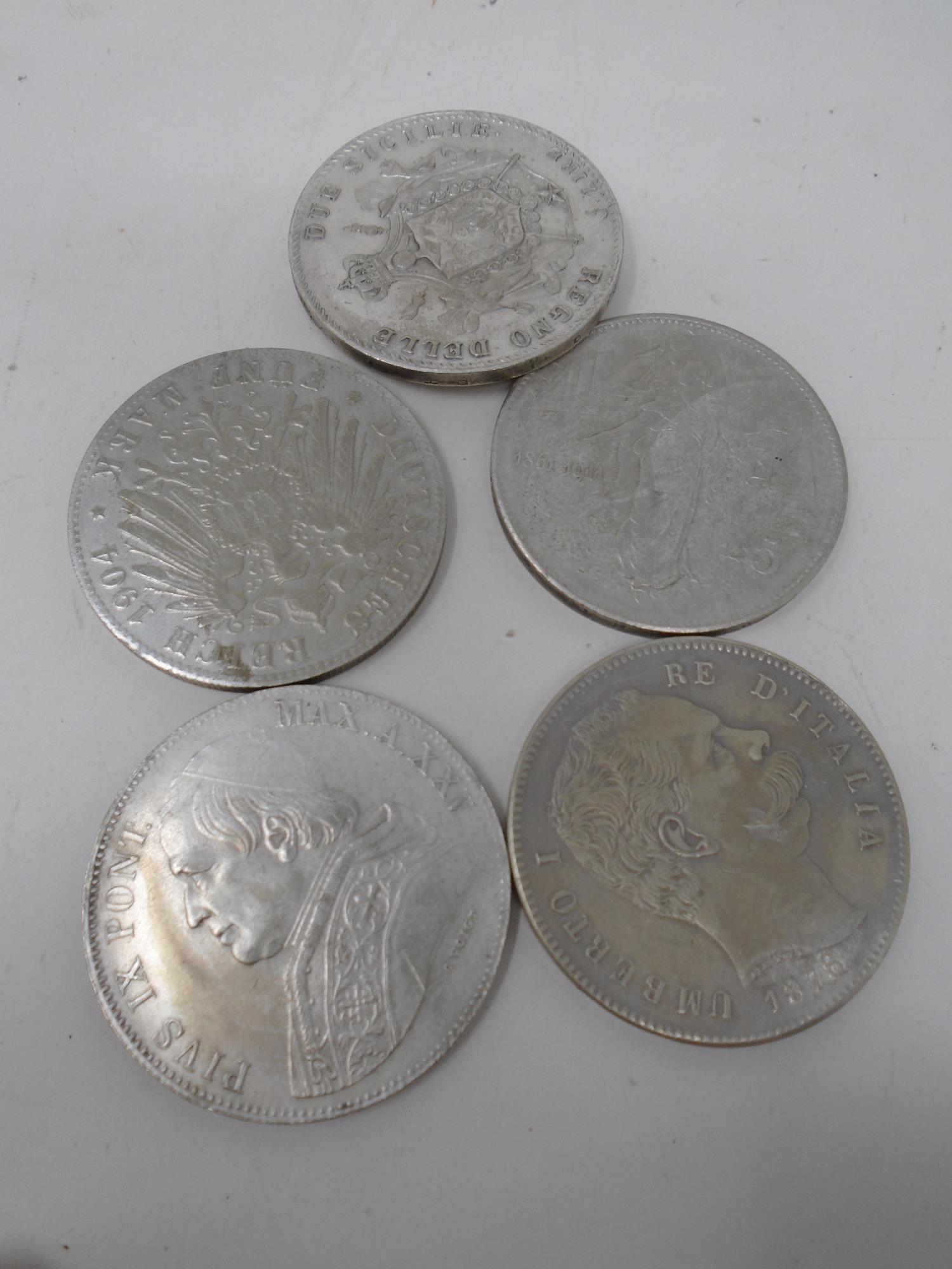 Five late 19th to early 20th century foreign coins.