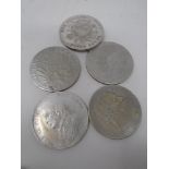 Five late 19th to early 20th century foreign coins.