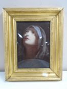 An antique crystoleum depicting a head study of a lady in a headscarf, 15cm by 21cm.