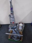 A Dyson DC14 upright vacuum together with a Vax Power Pet 6 cylinder vacuum with accessories.