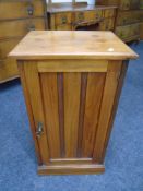 An Edwardian mahogany pot cupboard.