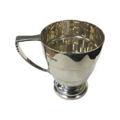 A silver mug, Walker & Hall, Sheffield 1954, height 8.5cm.