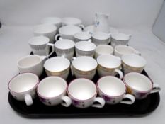 A tray of Villeroy and Bosch coffee cups and a Wedgwood part tea set.