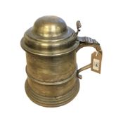 A novelty ice bucket modelled in the style of an antique pewter beer tankard with hinged lid,
