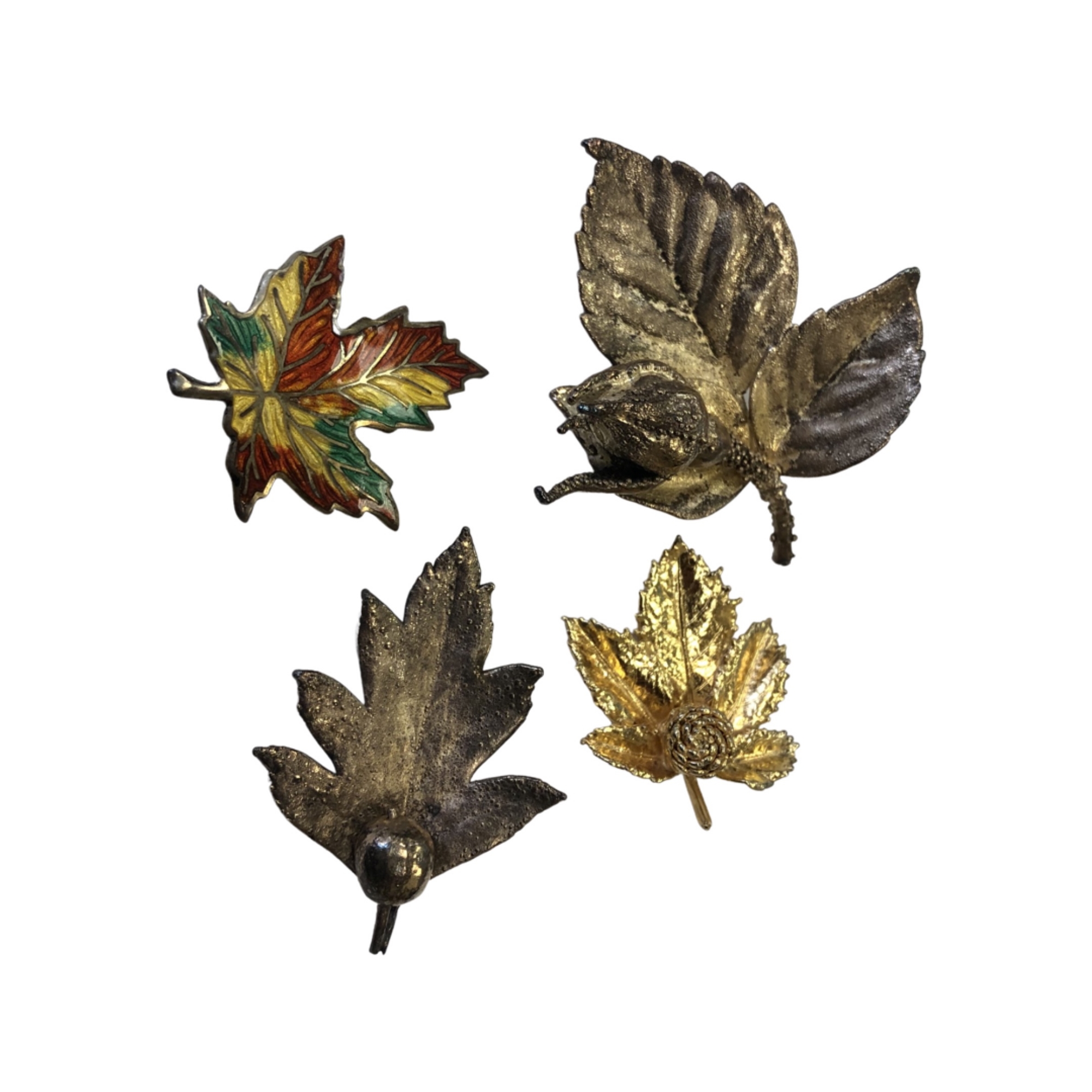 Three Danish Flora Danica leaf brooches and an enamelled silver maple leaf brooch.