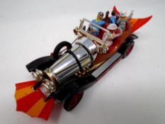 A Corgi Toys Chitty Chitty Bang Bang die cast vehicle with figures.