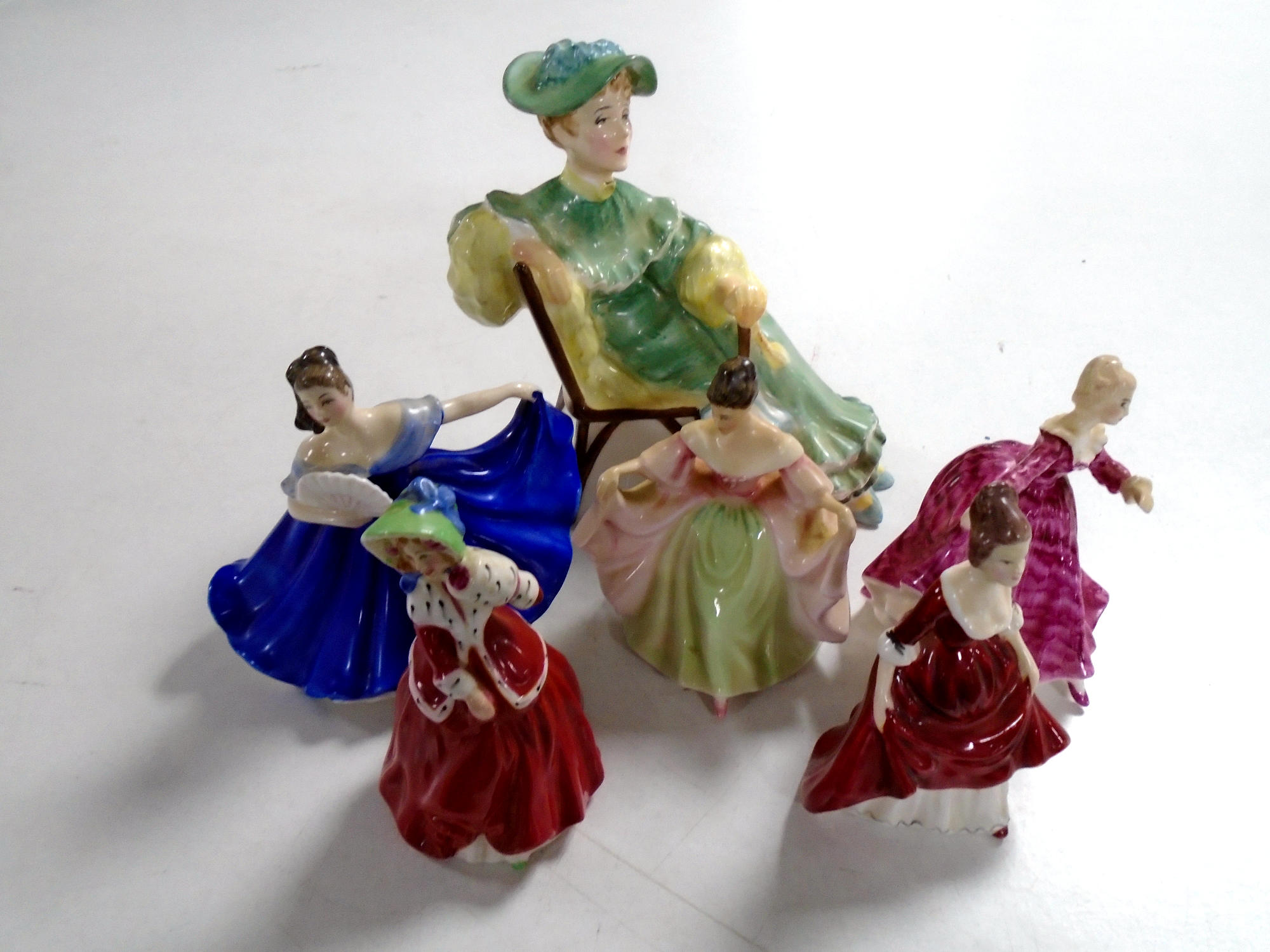 A Royal Doulton figure, Ascot HN2356 together with five further small Royal Doulton figures.