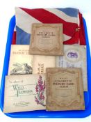 A tray containing Will's cigarette card albums including railway engines, film stars,