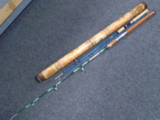 A didgeridoo together with two fishing rods