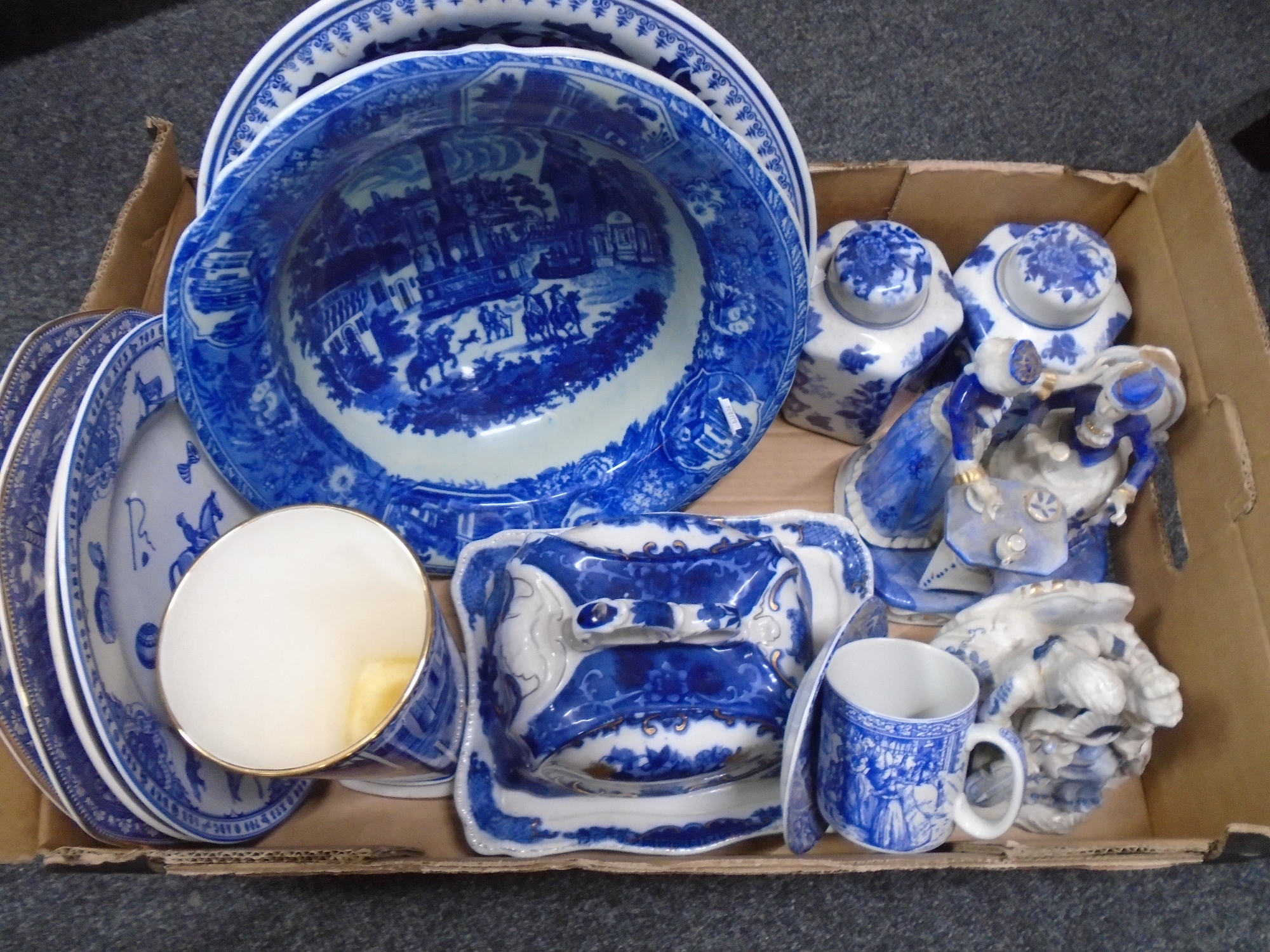 A box of blue and white china bowls, cheese dish and cover, figures etc.