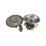 A silver-plated entrée dish, salver, ornate milk jug and a caster.