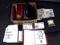 A box containing First Day Covers, albums of stamps, Stanley Gibbons albums etc.
