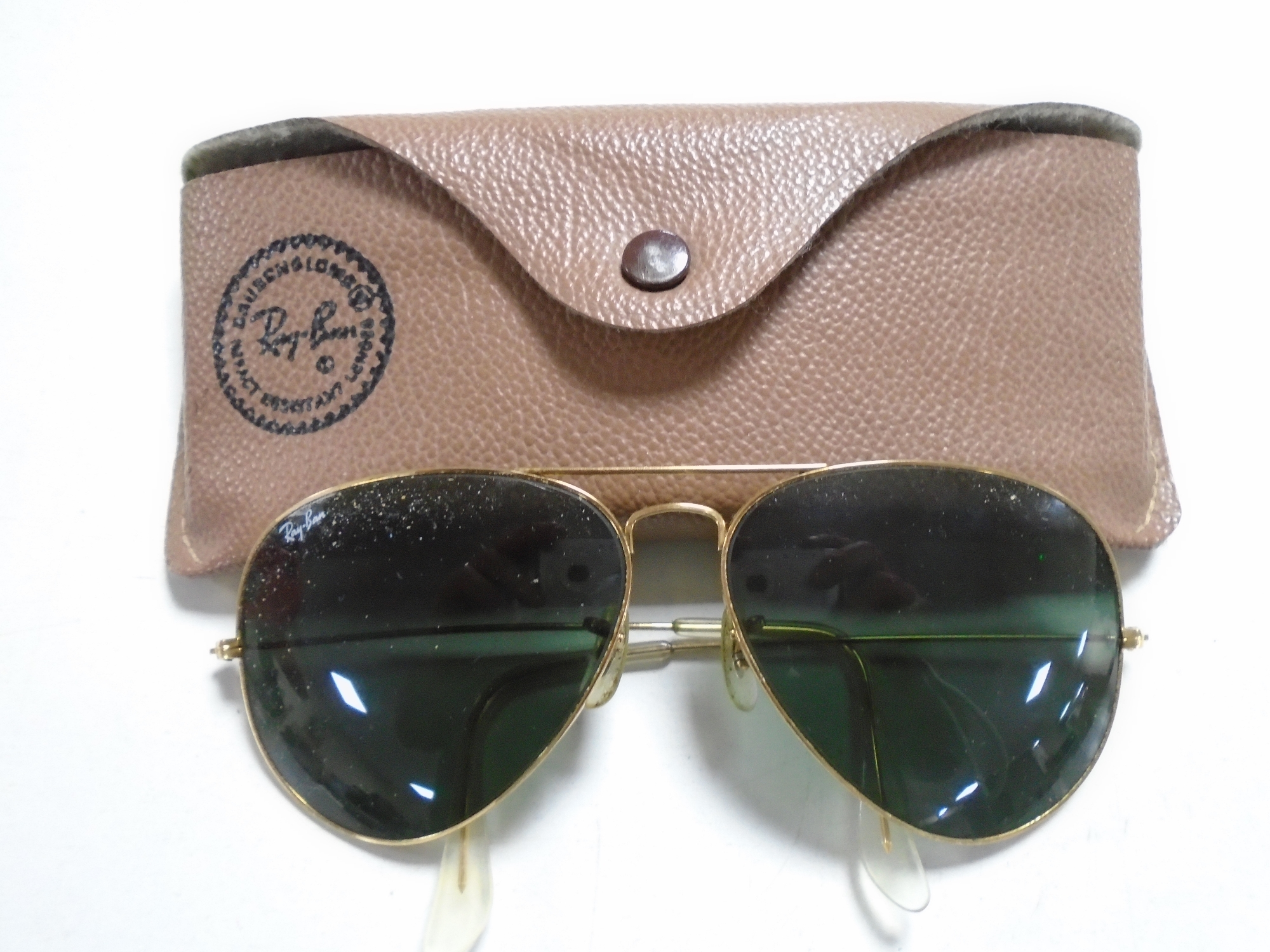 A pair of Ray-Ban aviator sunglasses in case.