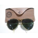 A pair of Ray-Ban aviator sunglasses in case.